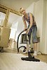 Woman vacuuming the floor