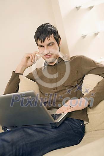 Man with lapton on the couch Man with lapton on the couch