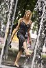 Woman getting wet in the fountain