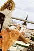 Woman reading a book on the roof