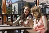 Two women having icecream and talking