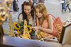 Two women looking at the shop window