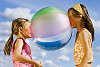 Two girls having fun with the beach ball