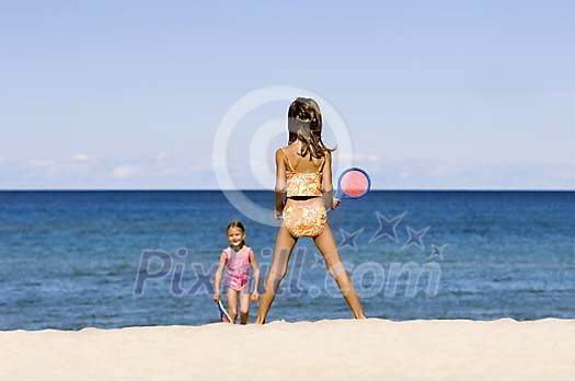 Girls playing on the beach Girls playing on the beach