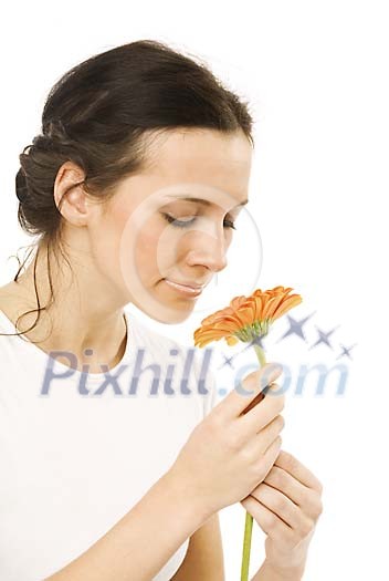 Woman smelling the gerbera Woman smelling the gerbera