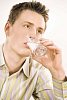 Man drinking a glass of milk