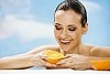 Woman peeling orange