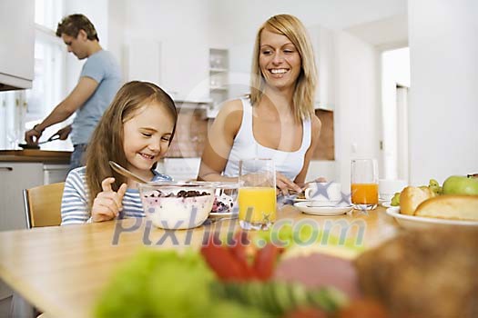 Family having breakfast in the kitchen