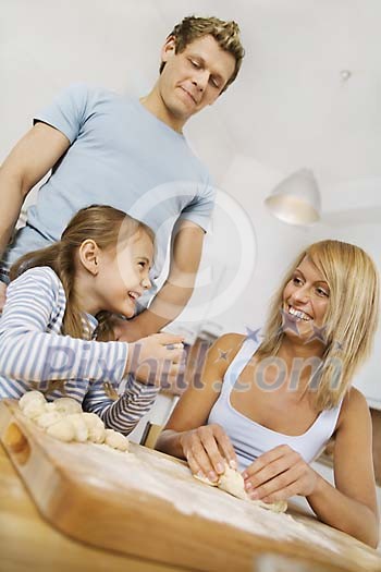 Family in the kitchen messing with dough Family in the kitchen messing with dough