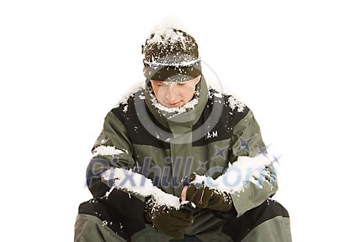 Man covered in snow, fishing Man covered in snow, fishing