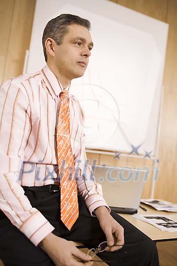 Man sitting in front of the class Man sitting in front of the class