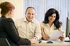 Two women and a man having a meeting