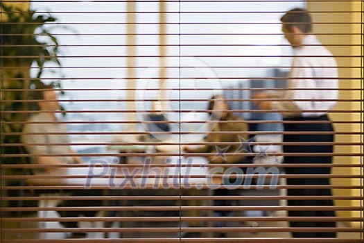 Two man and a woman having a meeting Two man and a woman having a meeting