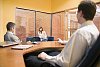 Two men and a woman in the office