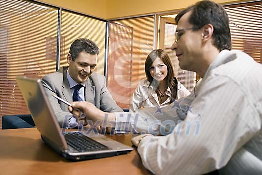 Two men and a woman in the office Two men and a woman in the office
