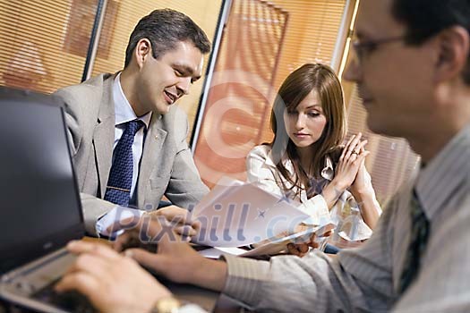 Two men and a woman in the office Two men and a woman in the office
