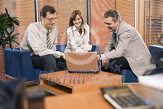 Two men and a woman in the office Two men and a woman in the office