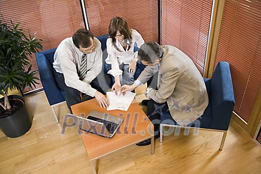Two men and a woman in the office Two men and a woman in the office
