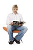 Man sitting and looking through the magazine