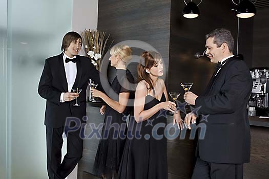 Men and women standing at the bar Men and women standing at the bar