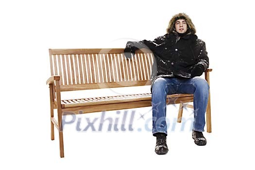 Man sitting on the bench in winter clothes Man sitting on the bench in winter clothes