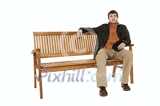 man sitting on the bench in autumn clothes man sitting on the bench in autumn clothes