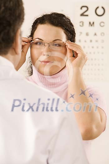 Woman at the eye doctors appointment Woman at the eye doctors appointment