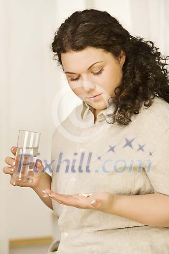 Woman taking her medicine Woman taking her medicine