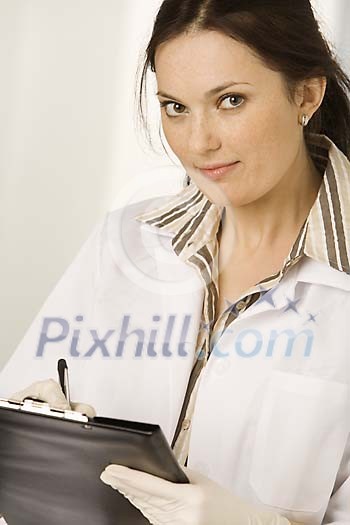 Female nurse writing Female nurse writing