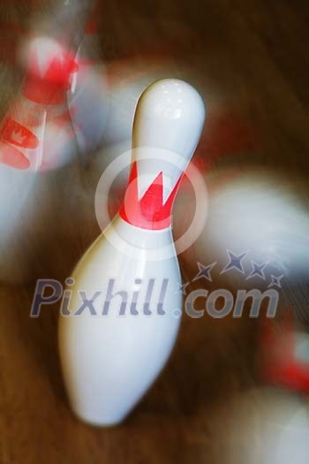 Closeup of bowling pins falling Closeup of bowling pins falling