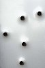 Closeup of a metal plate with holes in it