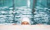 Older woman peeking in the pool