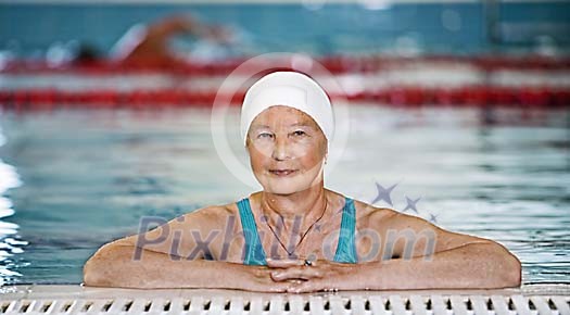 Older woman in the pool Older woman in the pool