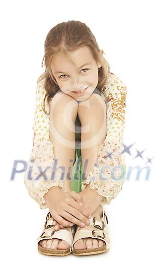 Girl sitting with hands over her legs Girl sitting with hands over her legs