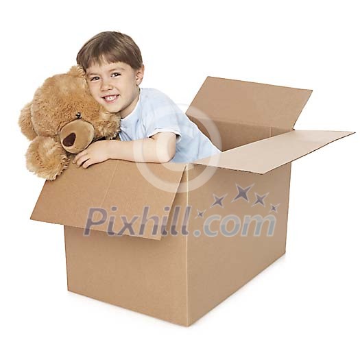 Boy in the cardboard box with toy bear Boy in the cardboard box with toy bear