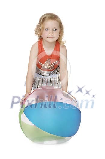 Girl standing behind the beachball Girl standing behind the beachball