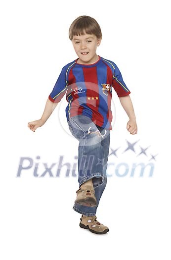 Boy after kicking the ball Boy after kicking the ball