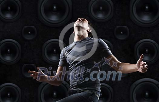 Man dancing in front of the speakers Man dancing in front of the speakers