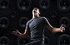 Man dancing in front of the speakers