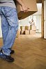 Man carrying a box to the flat