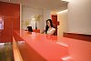 Woman sitting behind desk