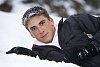 Boy lying in the snow