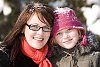 Mother and daughter outside at winter