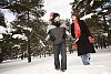 Family walking in the winter forest