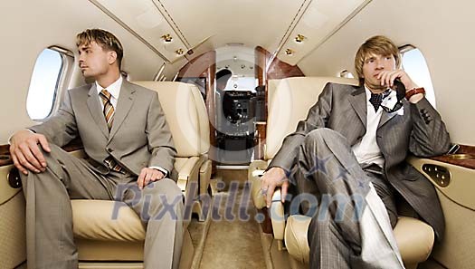 Two men travelling in the jet Two men travelling in the jet