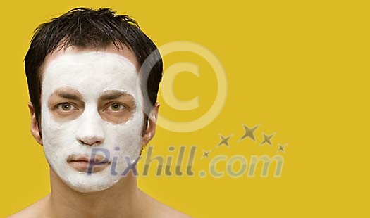 Man with a skincare mask Man with a skincare mask