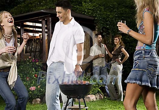 People having a barbeque in the garden