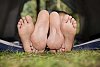 Couples feet at the tent door