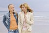Two women talking at the beach