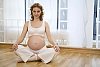 Pregnant woman sitting on the floor